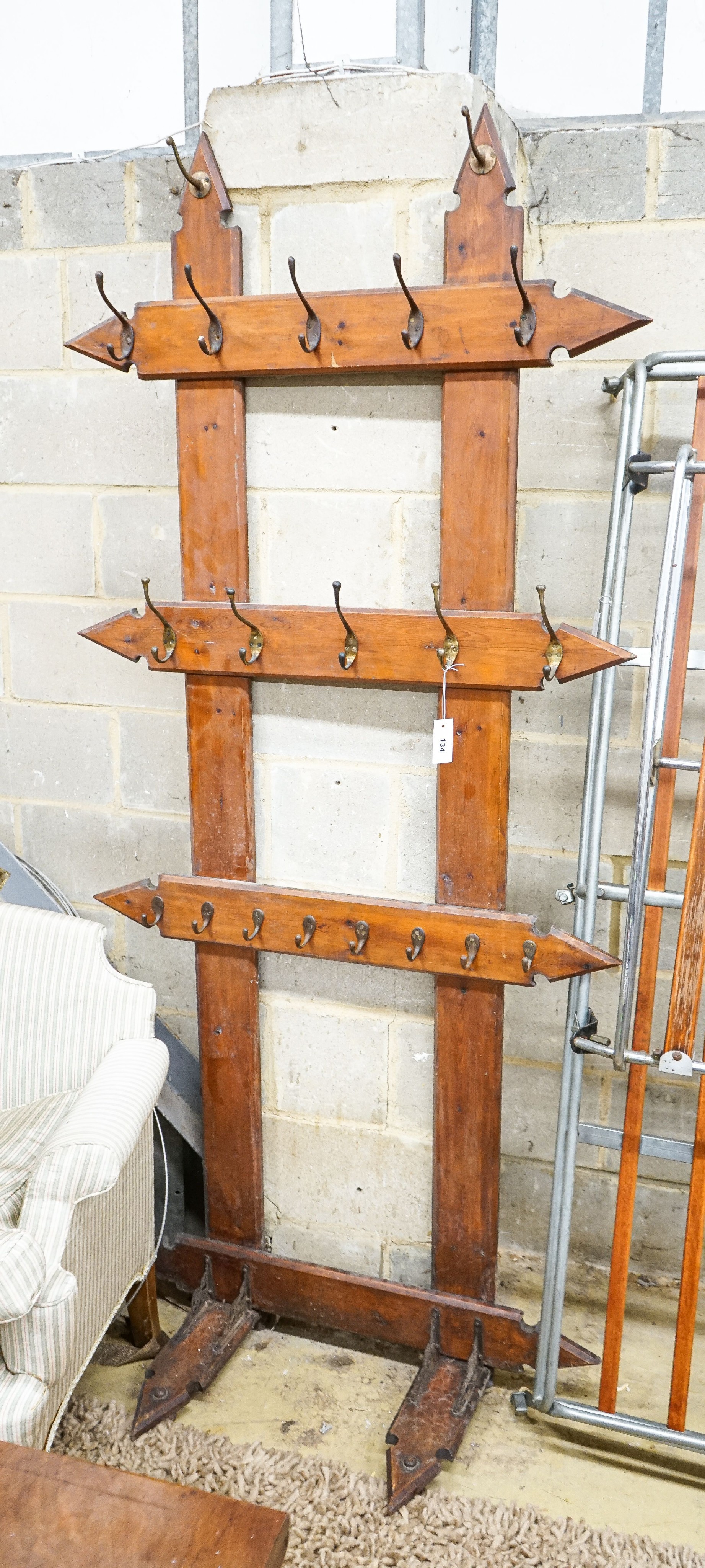 A late Victorian pitch pine hall stand, width 96cm, height 212cm